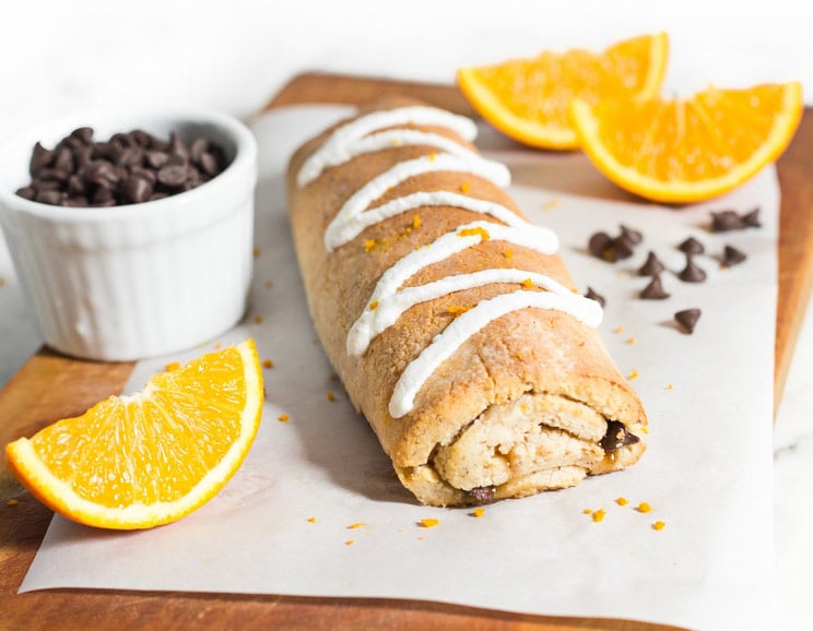 Combine chocolate and orange together in a simple loaf topped with dairy-free coconut icing. This loaf comes studded with natural sweet flavors