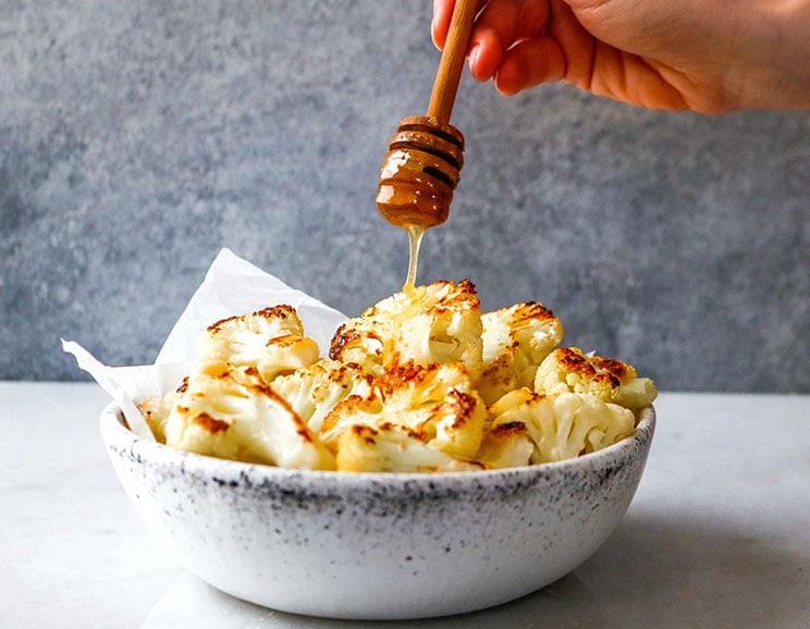 Combine garlic and honey with roasted cauliflower for a sweet and savory five-ingredient recipe. What can't cauliflower do?