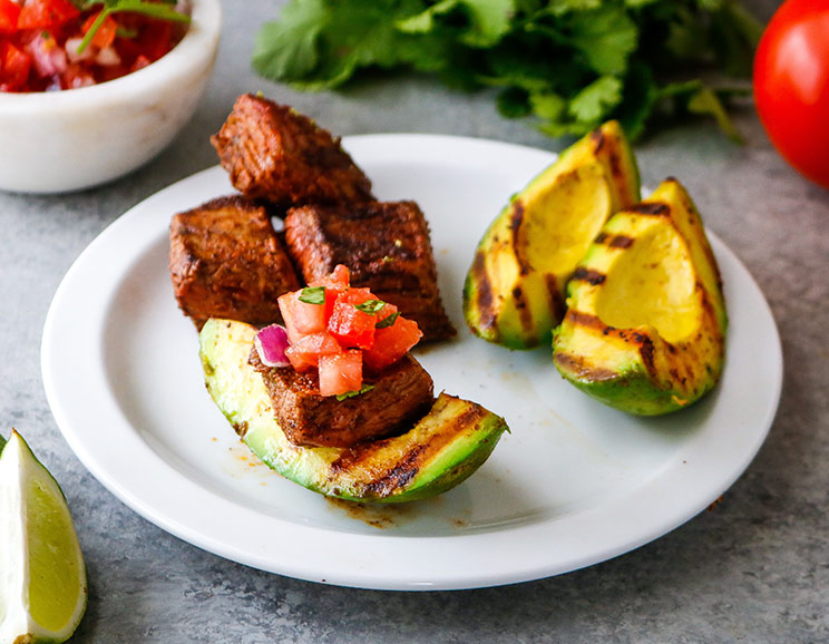 Grill up some chili lime steak bites and avocado for a complete dinner chock-full of healthy fats, protein, and flavor. Grill your avocado. Trust us!