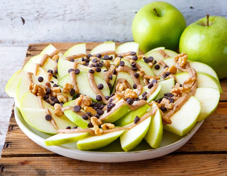 Nachos get a sweet makeover with crunchy apples, rich dark chocolate, and a naturally sweet, 4-ingredient Paleo caramel sauce!