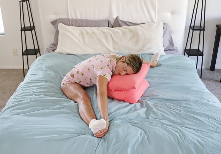 9 Soothing Hip Stretches You Can Do Right in Bed