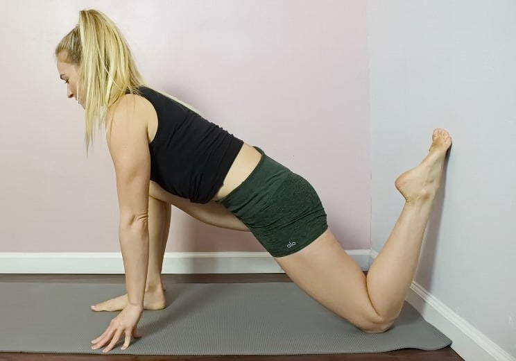 9 Soothing Wall Stretches to Release Low Back & Hip Pain