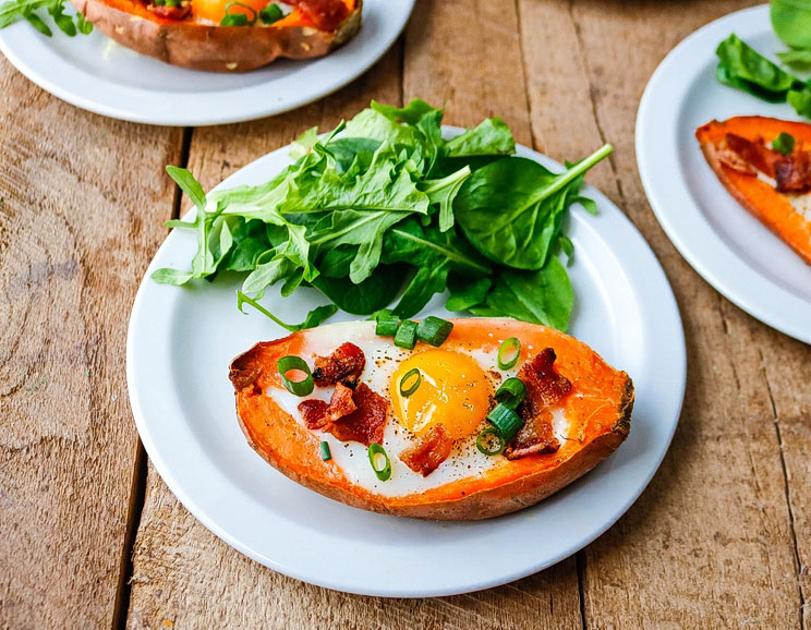 This perfectly-portioned egg boat is full of smoky bacon and beta carotene-rich sweet potatoes, with a dose of protein baked into each potato.