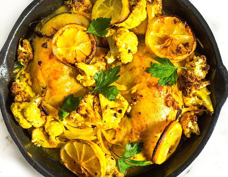 Put your cast-iron skillet to good use with this turmeric-infused chicken recipe, complete with cauliflower and sliced onions.