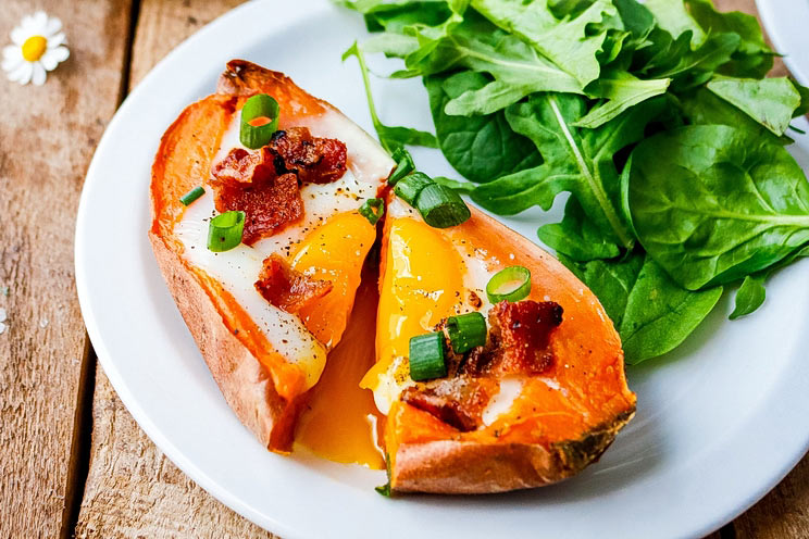 This perfectly-portioned egg boat is full of smoky bacon and beta carotene-rich sweet potatoes, with a dose of protein baked into each potato.