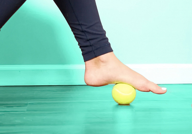 7 Tennis Ball Exercises to Soothe Stiff Muscles on Long Flights