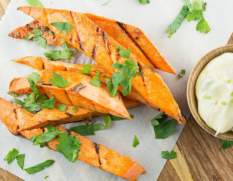 Looking for a finger food that's as nutritious as it is delicious? These grilled sweet potato fries with garlic chive aioli will fit the bill.