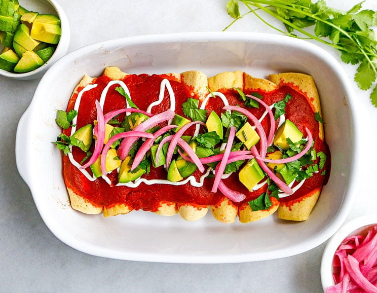 Add a Paleo twist to traditional enchiladas using grain-free tortillas and spicy chicken. When Mexican food is life, this healthy recipe has you covered!