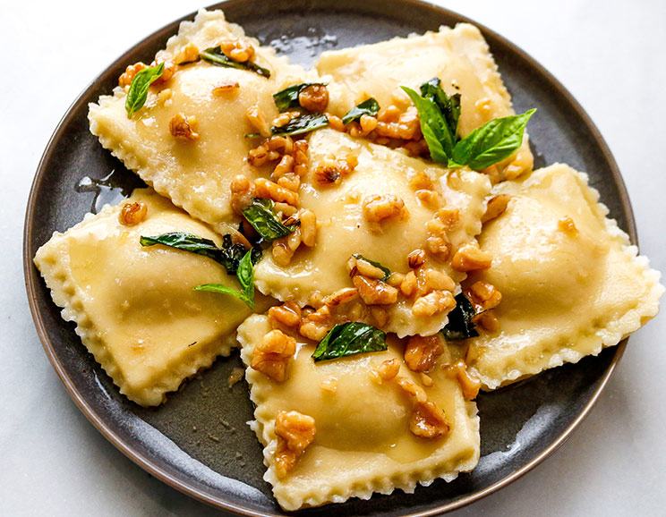 Indulge in a sweet and savory pumpkin ravioli topped with maple butter and crunchy walnuts. Pasta night gets a Paleo makeover with this grain-free recipe.