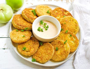 Dunk crispy fried green tomatoes in a smoky, spicy sauce for a gluten-free, Southern-inspired appetizer.