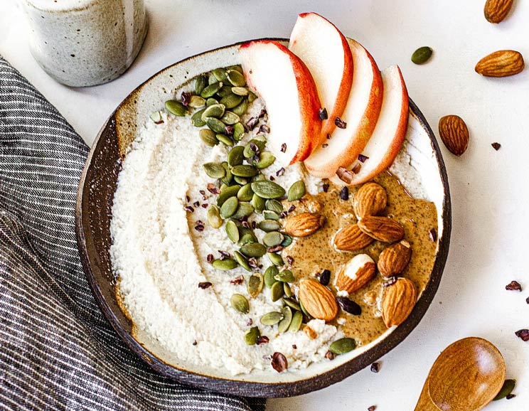 Hungry, but short on time? This nourishing coconut 'oatmeal' is made with only four ingredients for an unsuspecting tasty bowl of breakfast porridge!
