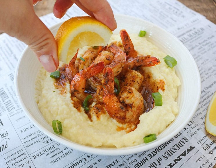 Take a trip to the Big Easy with this fresh take on Cajun shrimp and grits! Shrimp gets coated in spicy seasonings and served with cauliflower grits.