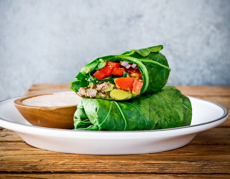 Wrap up your steak and veggie keto burrito in hearty collard greens and dip it in a creamy chipotle sauce for a fat-burning lunch.