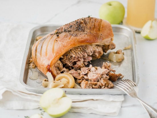 Sunday family dinner Crock Pot apple cider pork roast! A fall-off-the-bone tender pork roast that marries apple and pork in tangy, sweet and savory harmony.