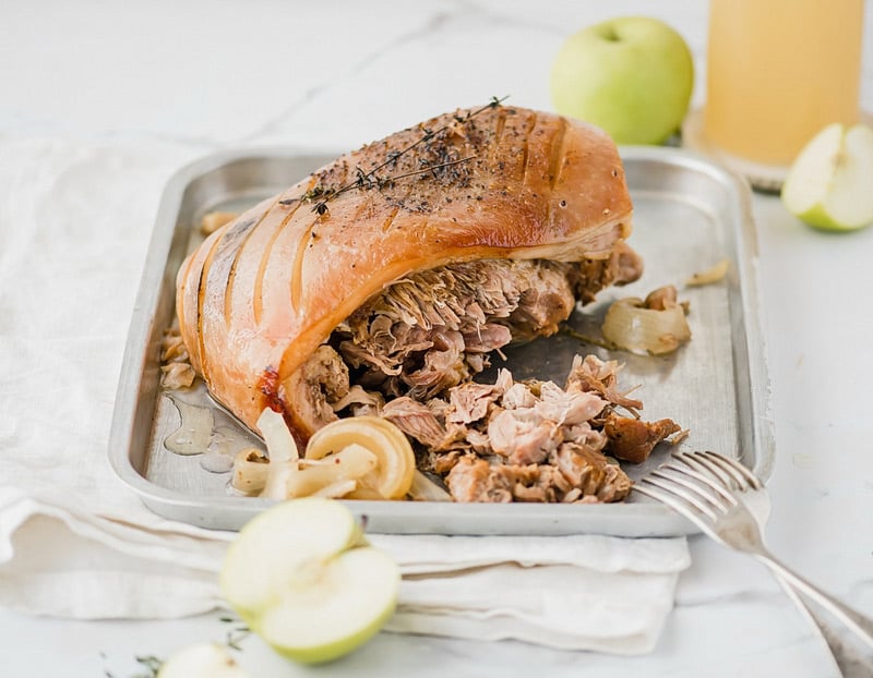 Sunday family dinner Crock Pot apple cider pork roast! A fall-off-the-bone tender pork roast that marries apple and pork in tangy, sweet and savory harmony.